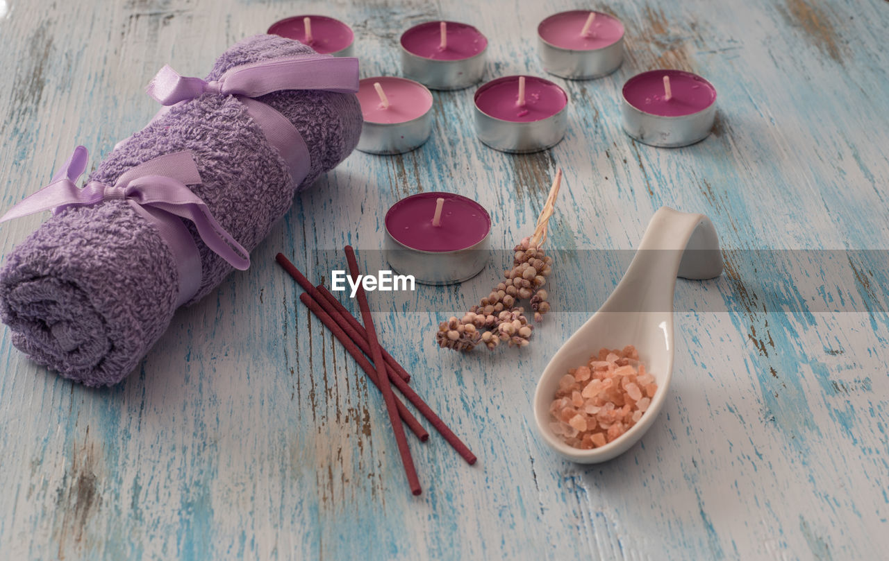 High angle view of spa treatment items on wooden table