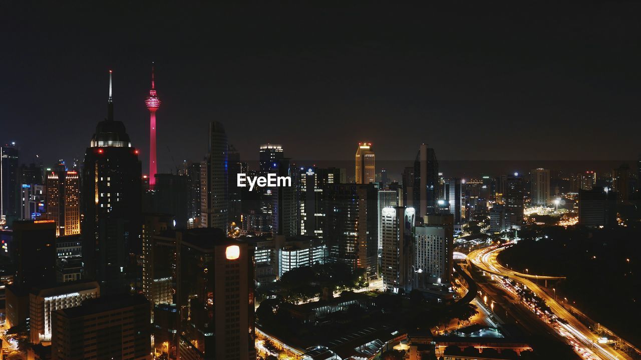 High angle view of skyscrapers lit up at night