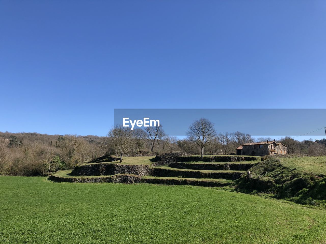 Built structure on field against clear sky