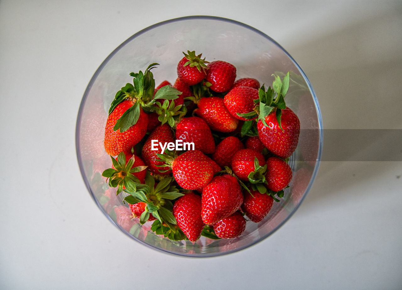 High angle view of strawberries in bowl on table