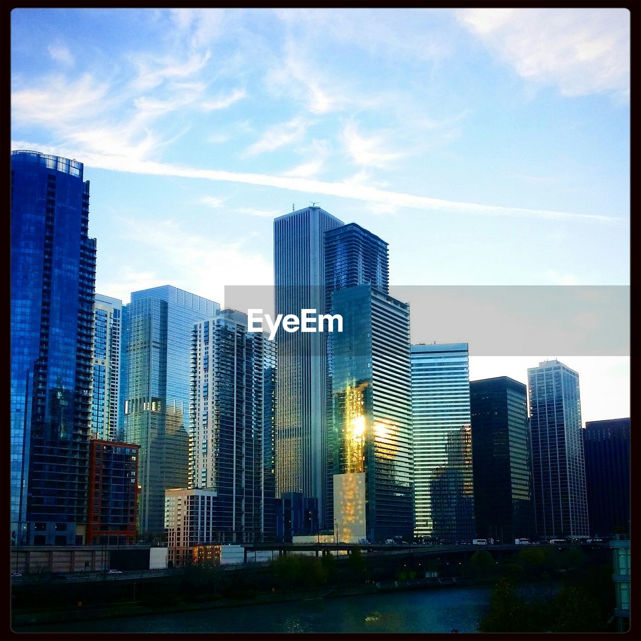 Low angle view of city skyline against sky