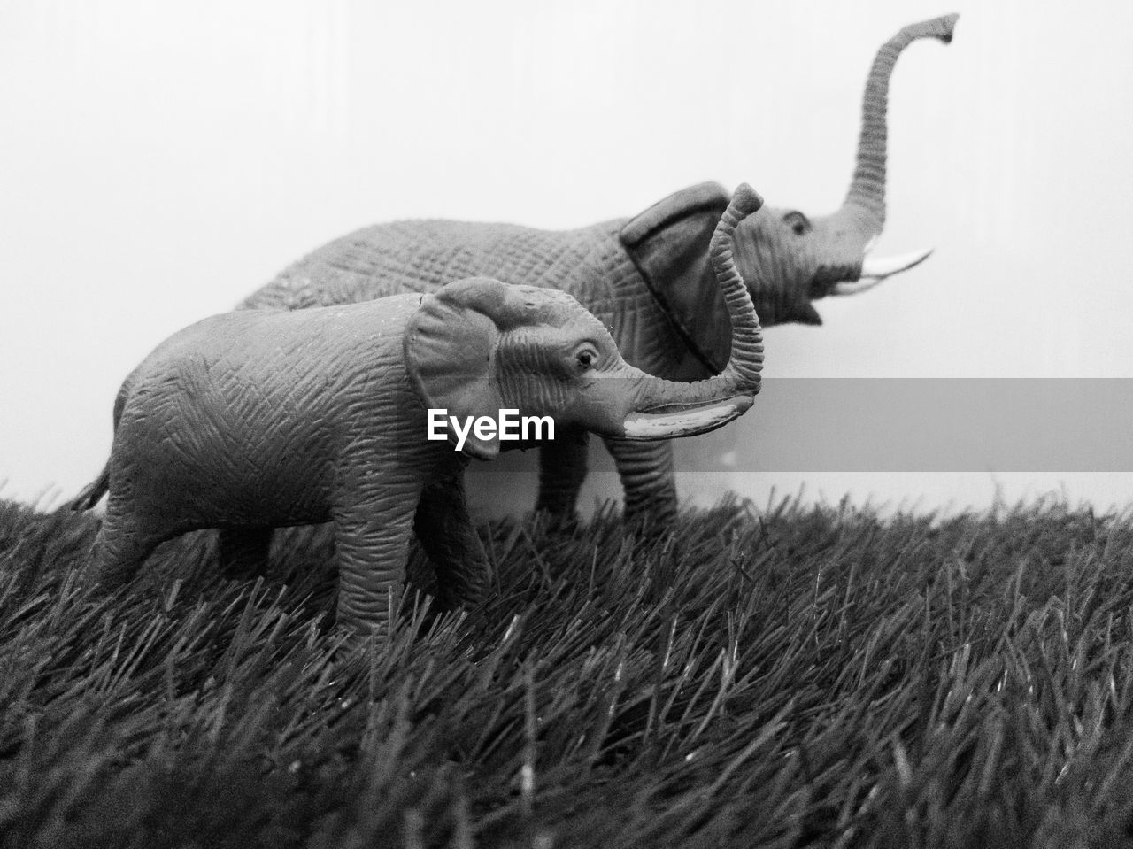 Close-up of elephant animal toys on field