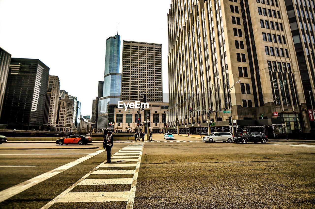 VIEW OF CITY STREET AGAINST SKY