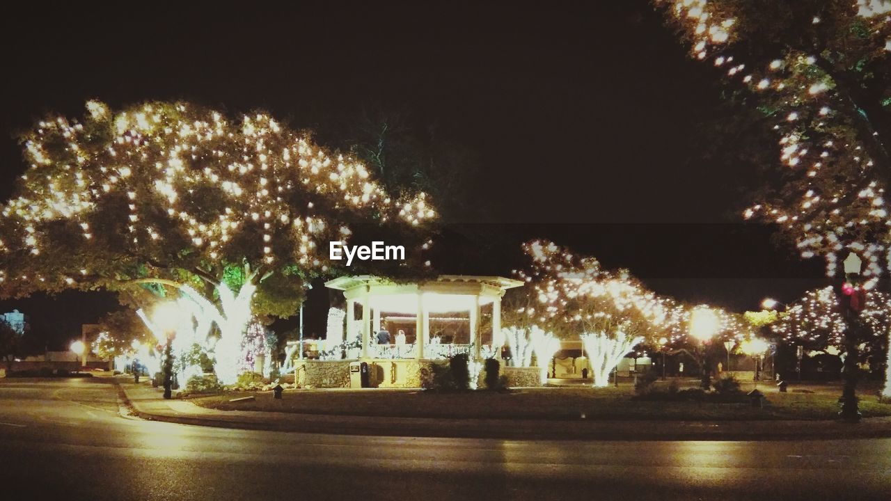 VIEW OF ILLUMINATED STREET LIGHT AT NIGHT