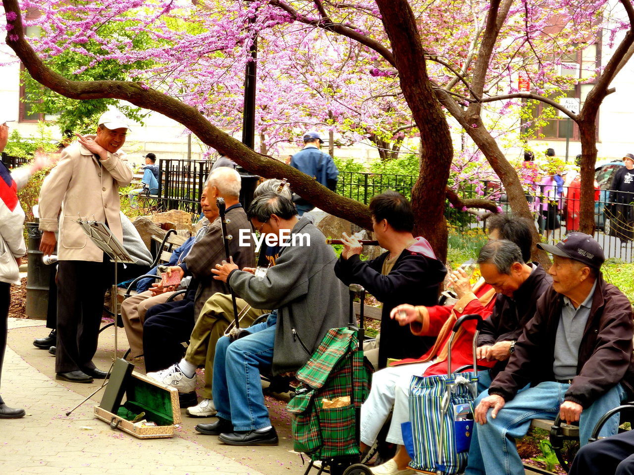 GROUP OF PEOPLE ON STREET