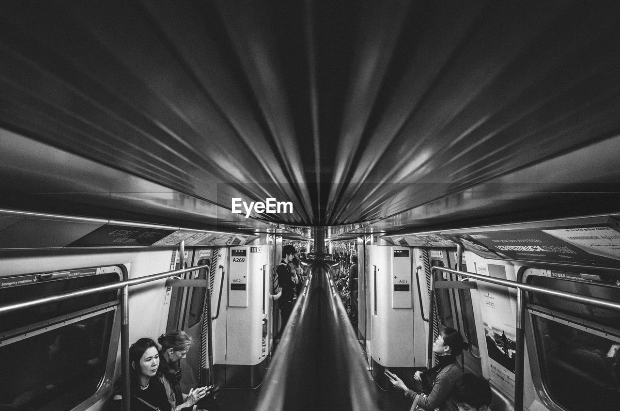 PEOPLE AT SUBWAY STATION PLATFORM