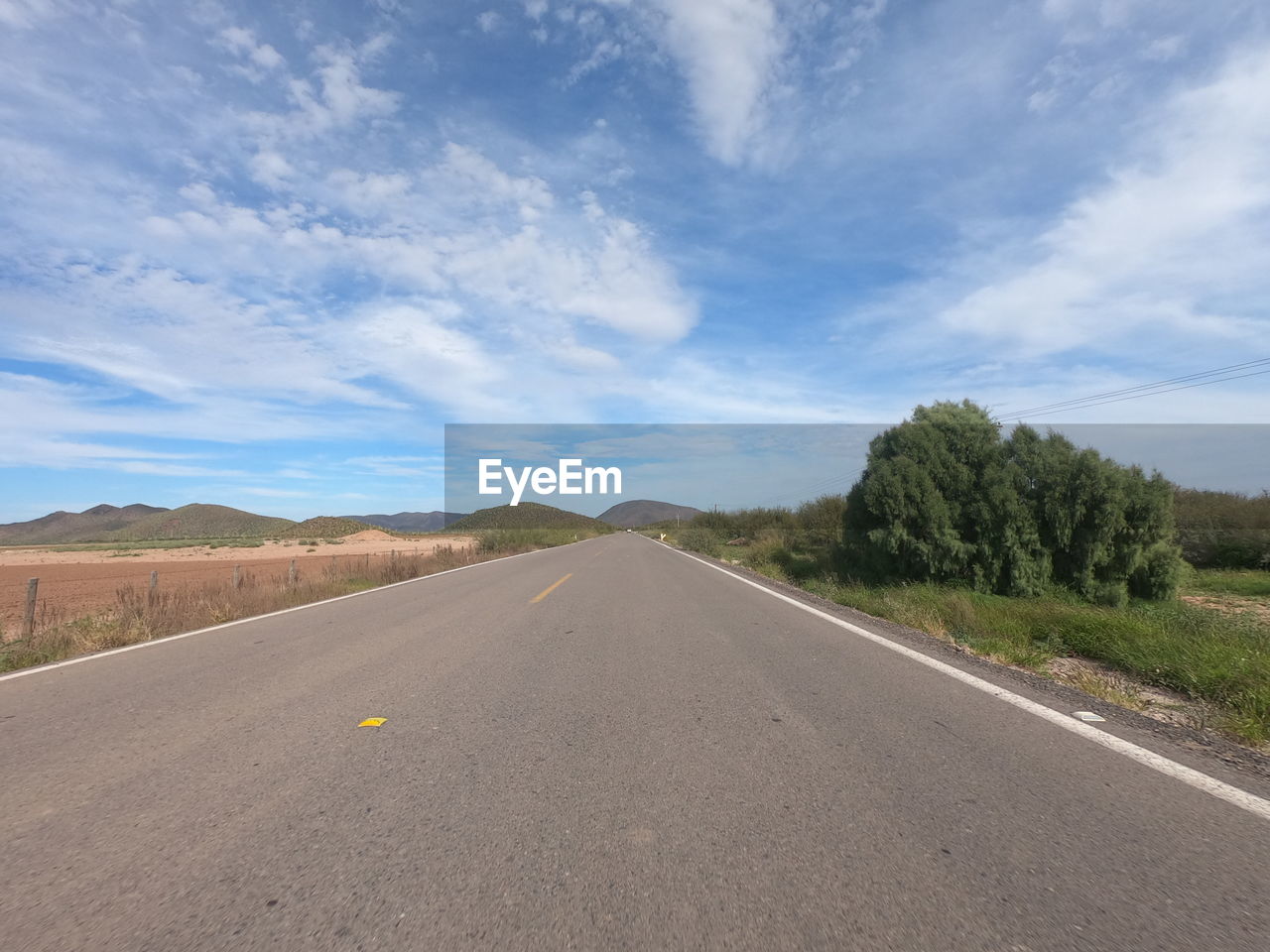 Surface level of road along countryside landscape