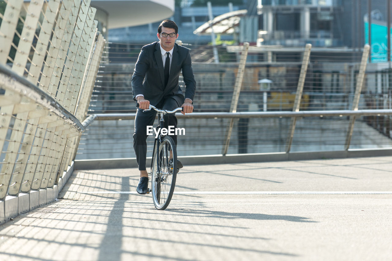 Man riding bicycle in city