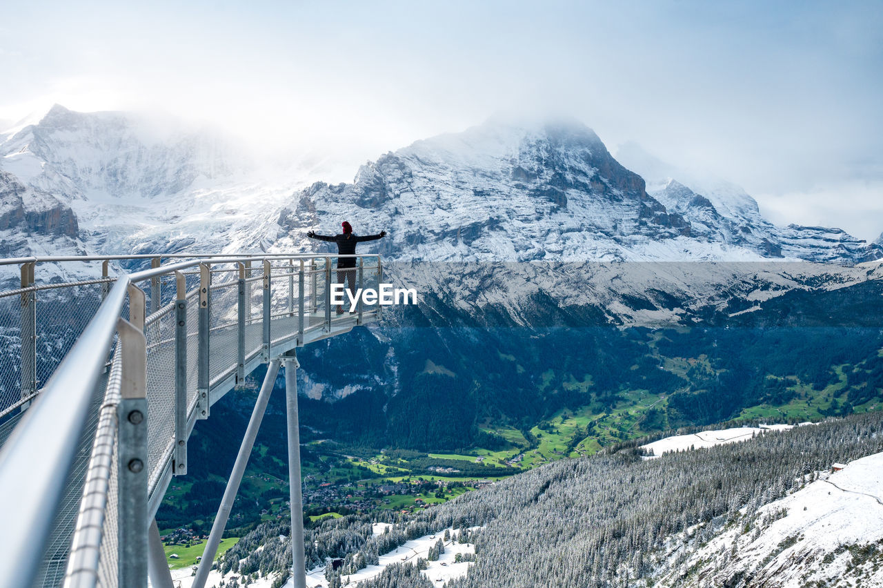 SCENIC VIEW OF SNOWCAPPED MOUNTAINS AGAINST SKY DURING WINTER