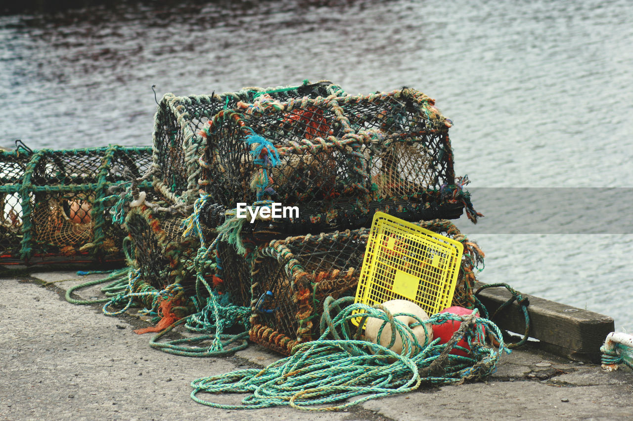 FISHING NET BY SEA AGAINST SKY