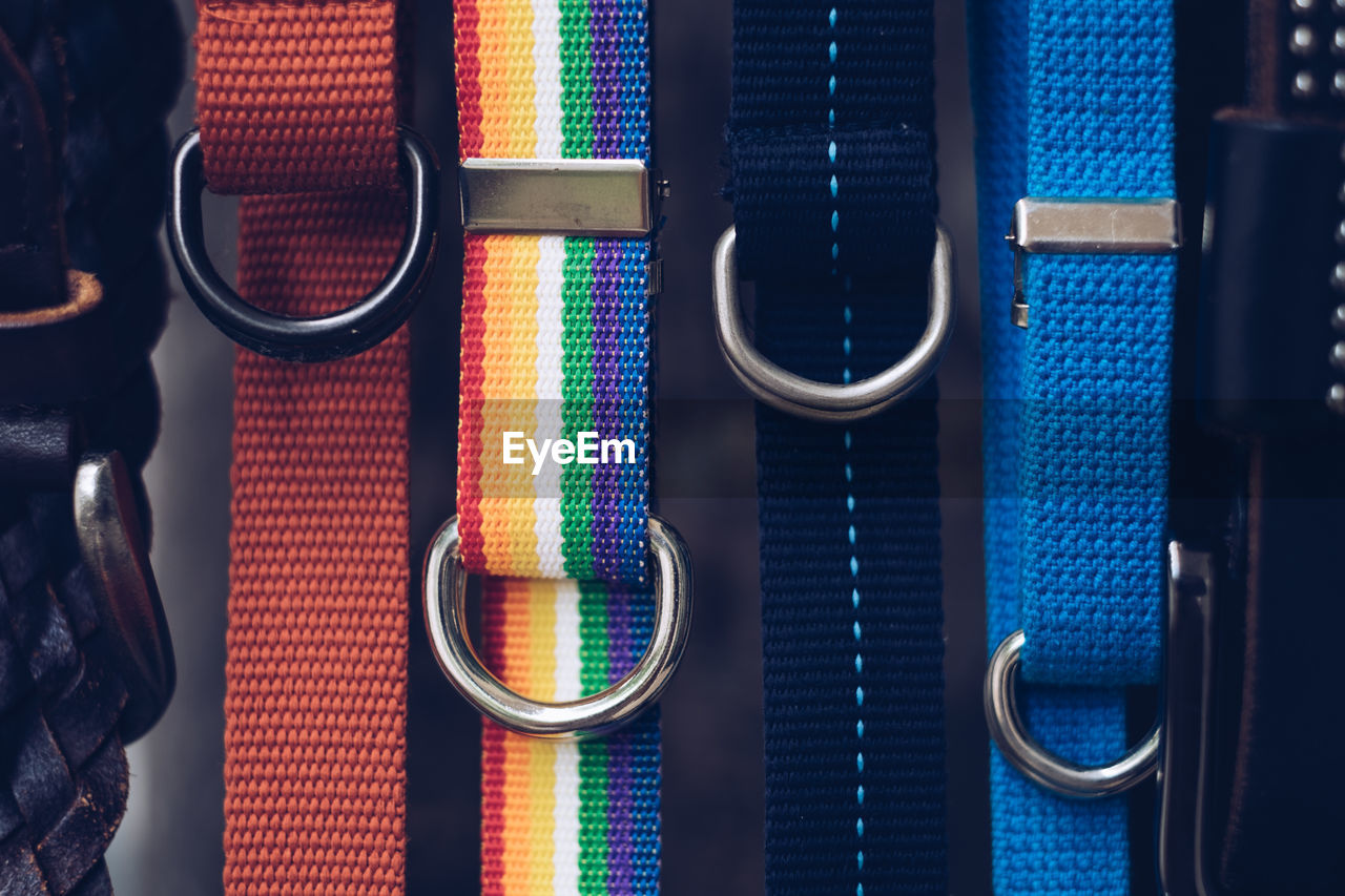 Close-up of colorful belts for sale