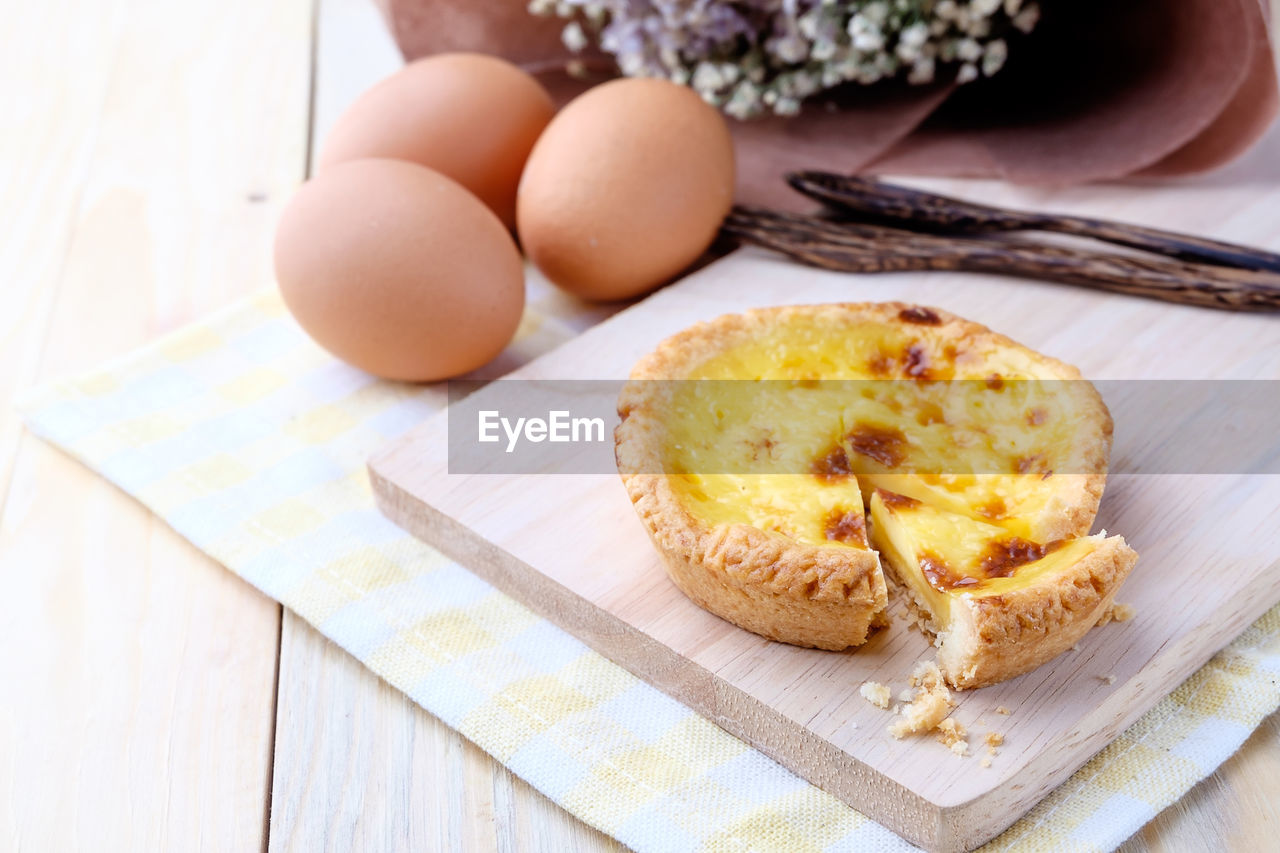 High angle view of eggs on cutting board