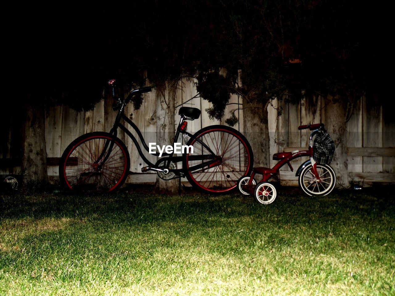 Bicycles by fence at park