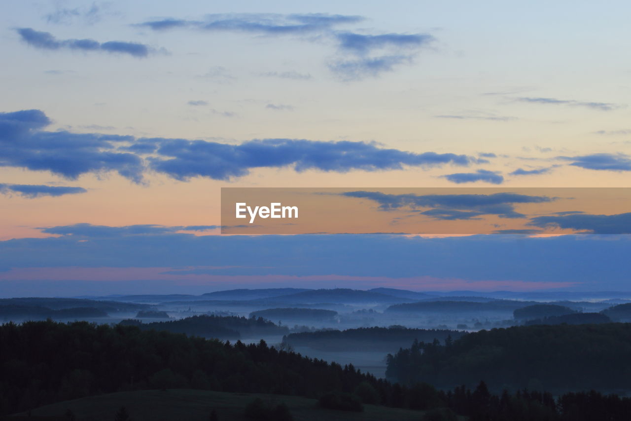 Scenic view of landscape against sky during sunset