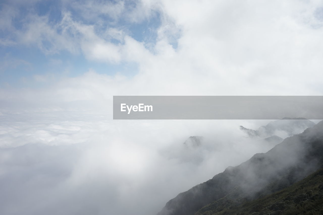 LOW ANGLE VIEW OF MAJESTIC MOUNTAINS AGAINST SKY