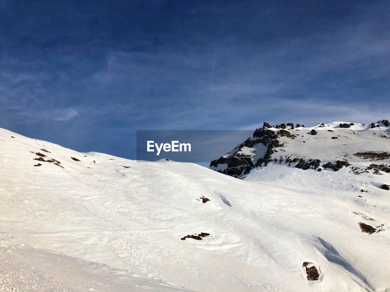 Snow covered mountain against sky