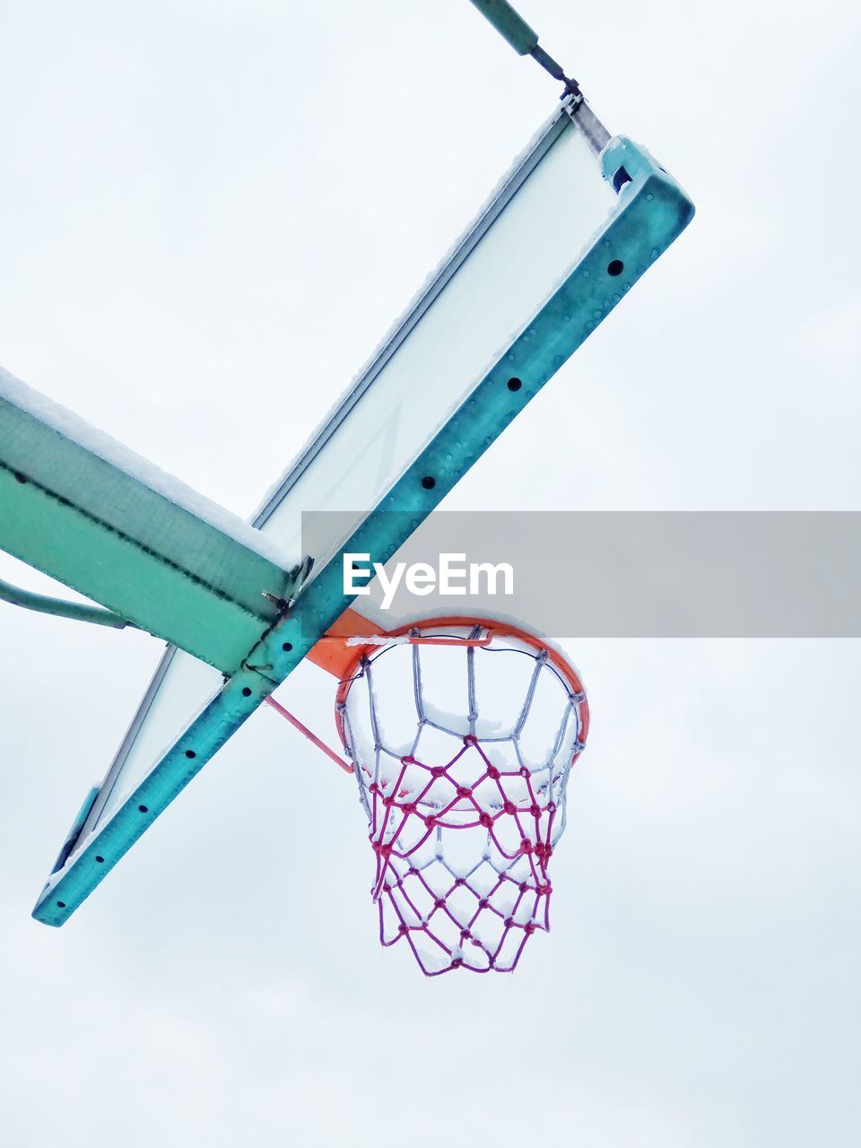 Low angle view of basketball hoop against sky