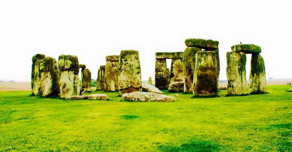 OLD RUINS ON GRASSY LANDSCAPE