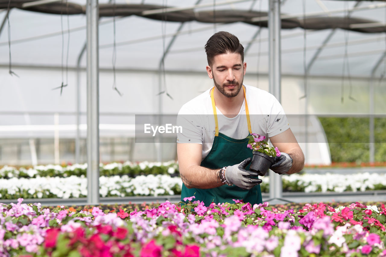 Full length of man working at flower