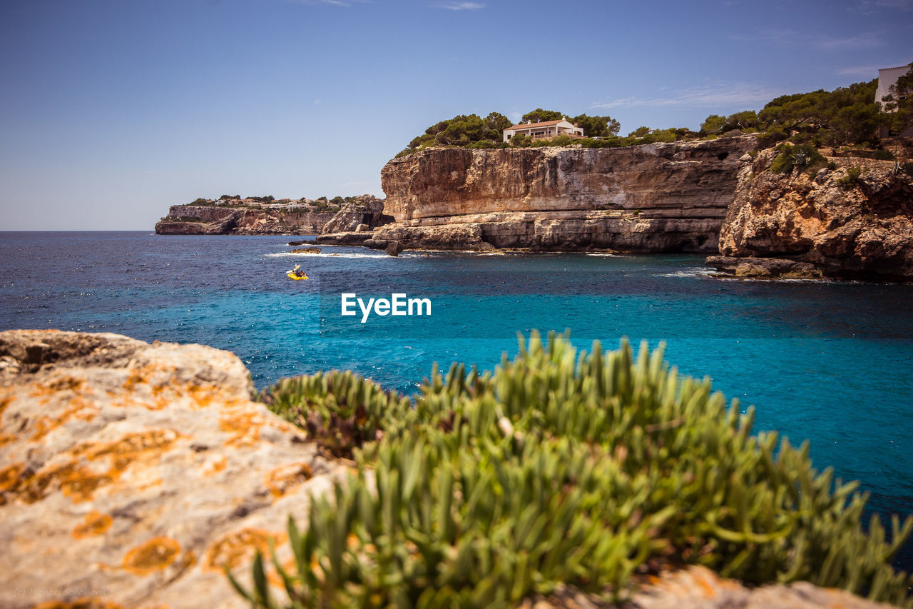 Scenic view of sea against clear sky