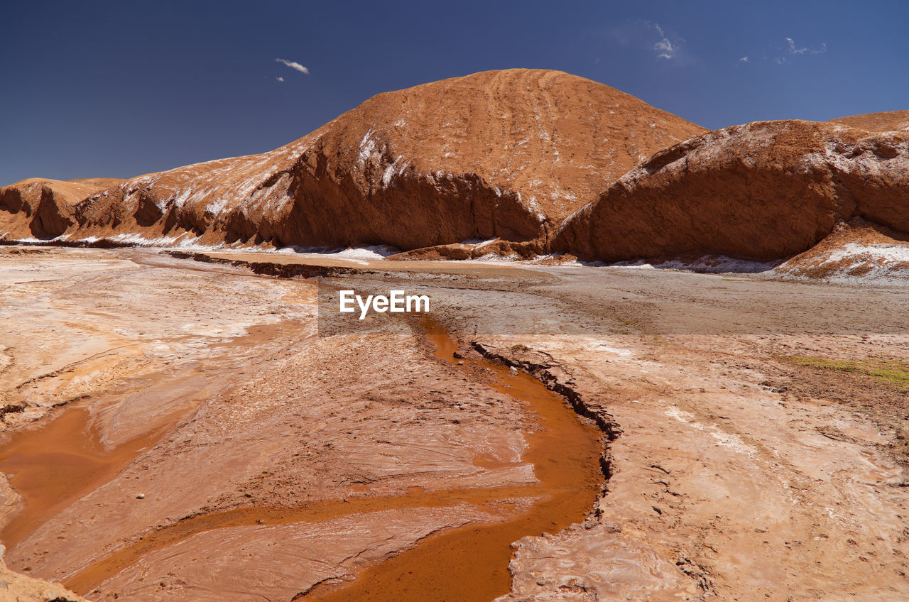 rock formations in desert against sky