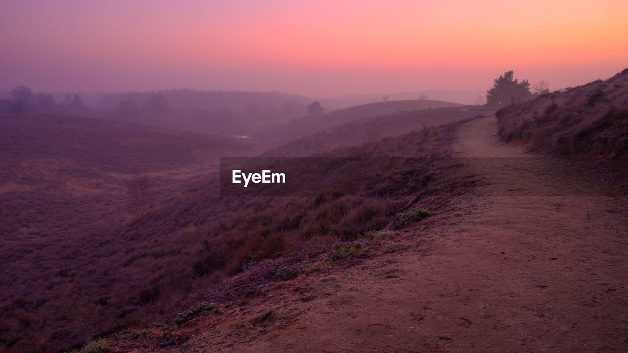 Scenic view of landscape against sky during sunset