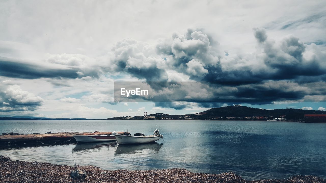 Scenic view of sea against cloudy sky