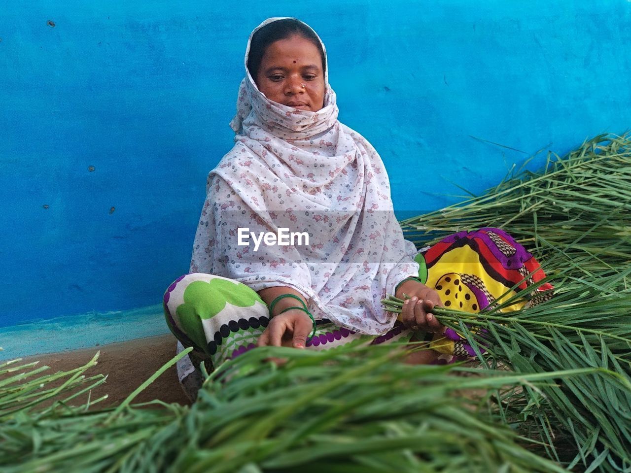 Woman that making broom 