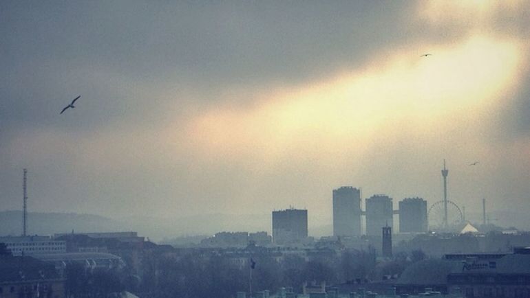 VIEW OF CITYSCAPE AT SUNSET