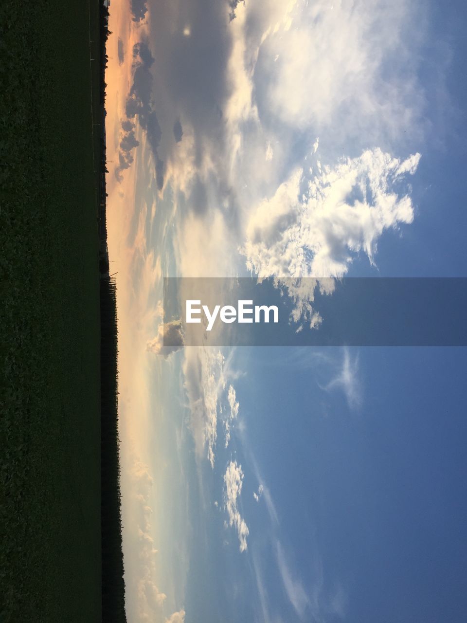 SCENIC VIEW OF CLOUDS OVER LANDSCAPE