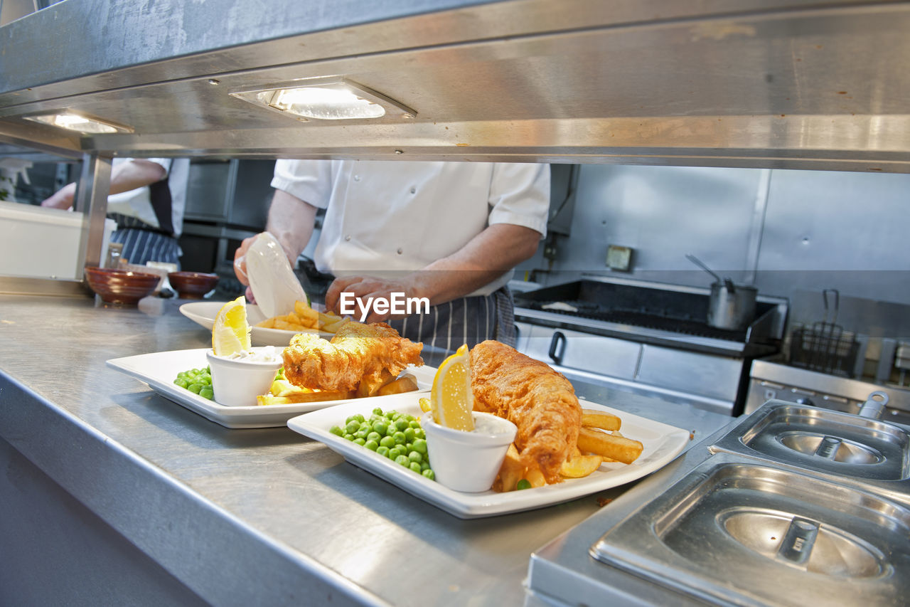 Fish and chips prepared at commercial kitchen in the uk