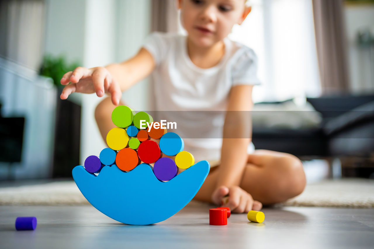 portrait of boy playing with toy blocks