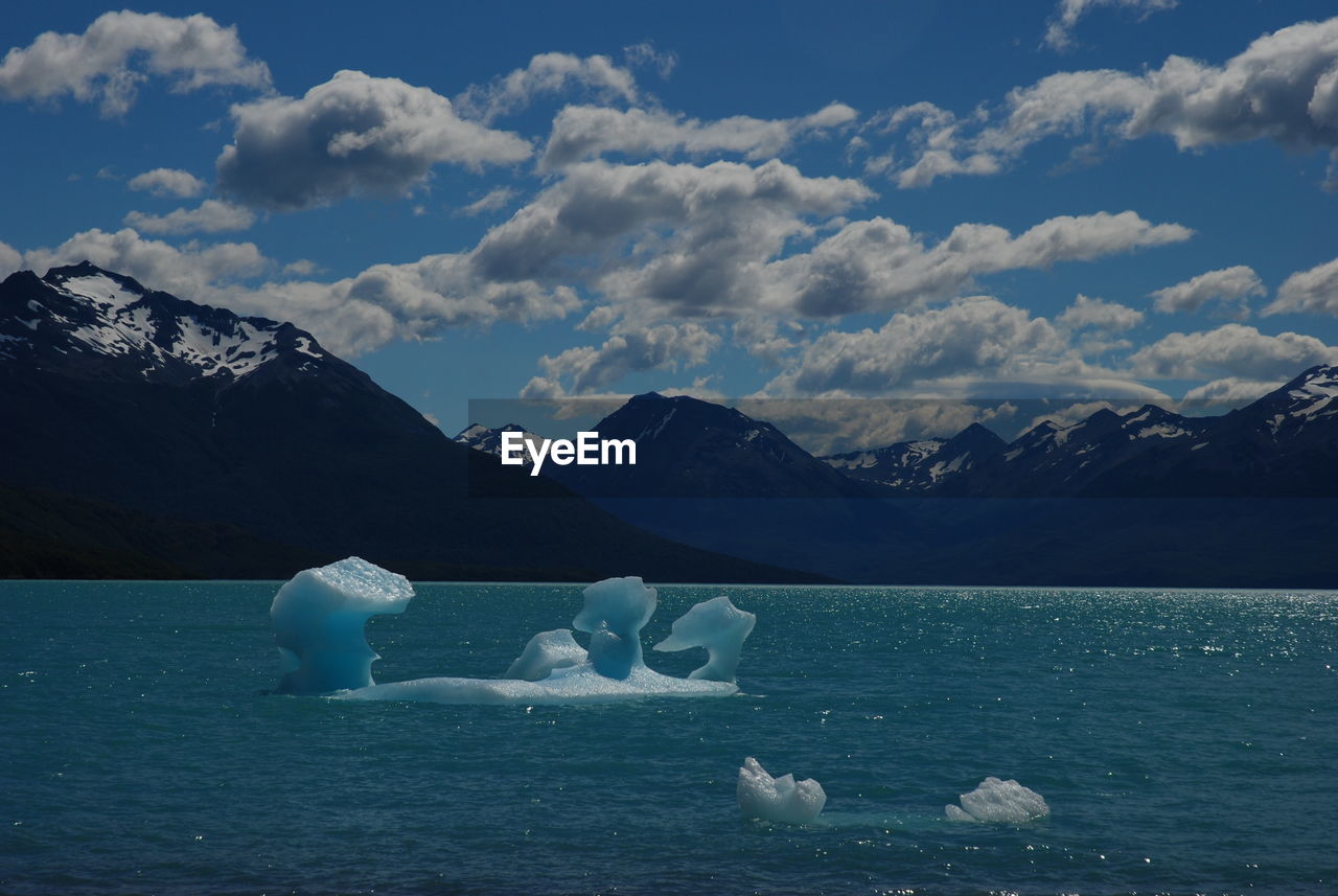 Scenic view of lake with mountains in background