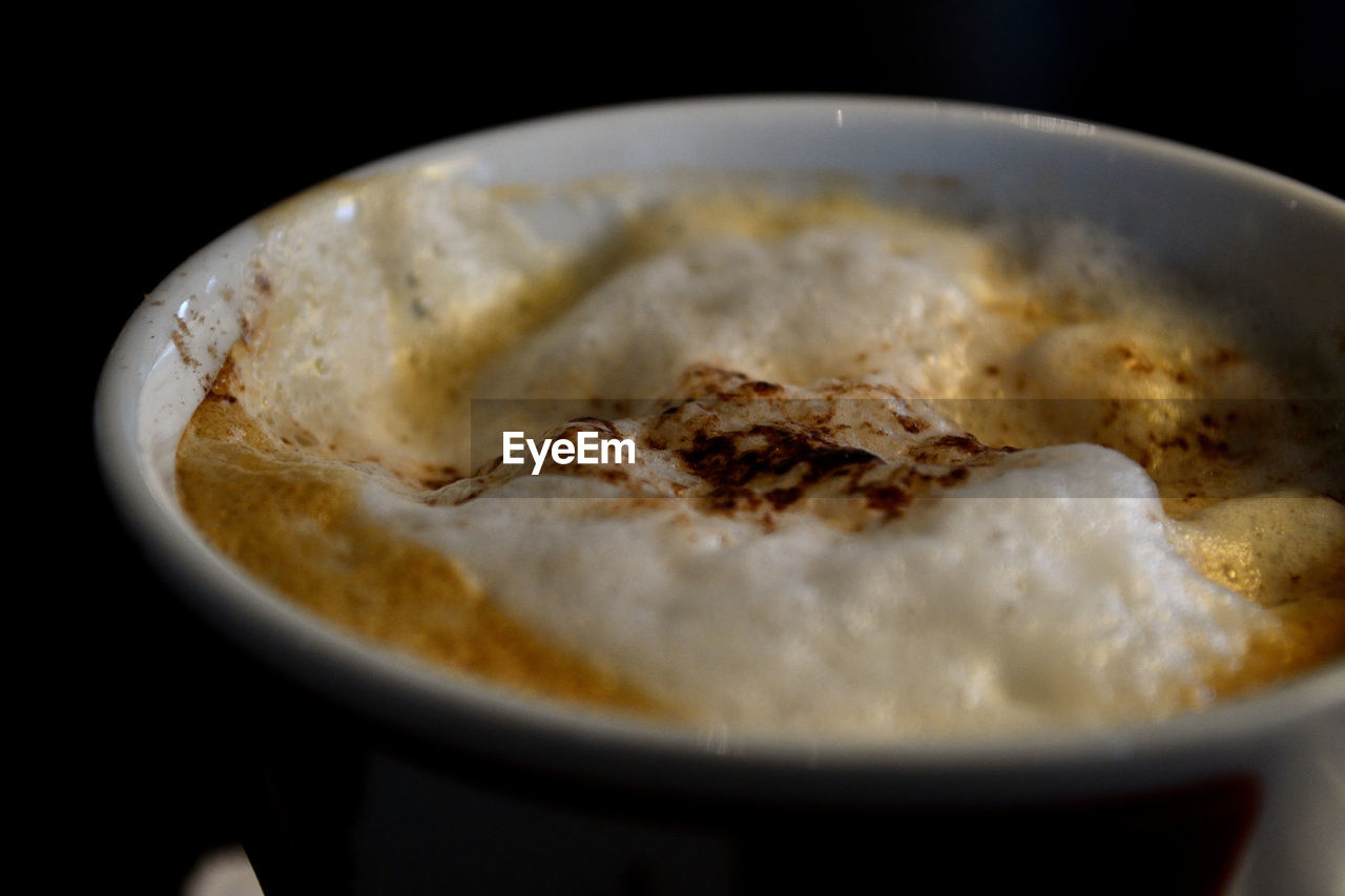 Close up  view of a cup of cappuccino cofee