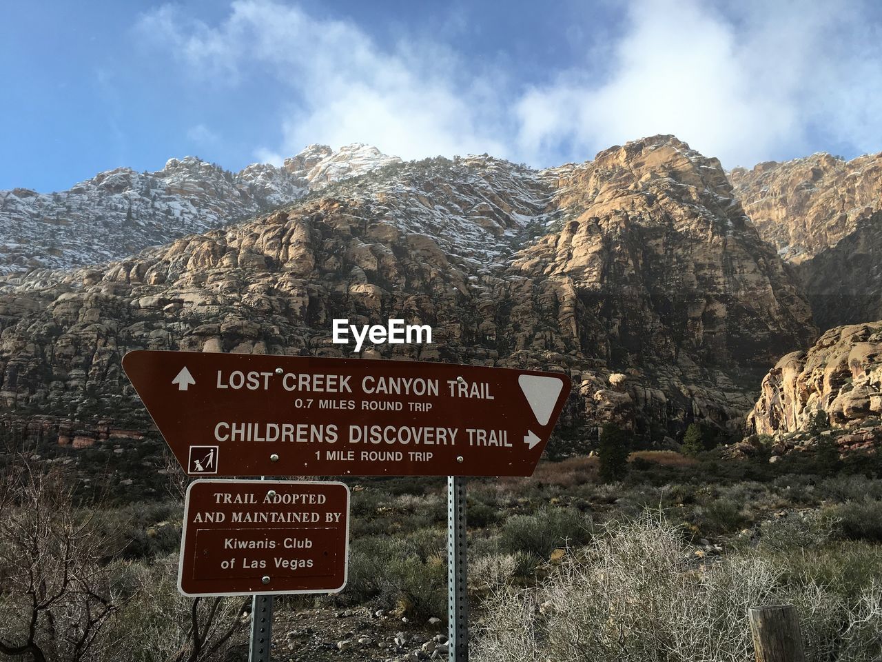 Information sign against rocky mountains at canyon creek trailhead
