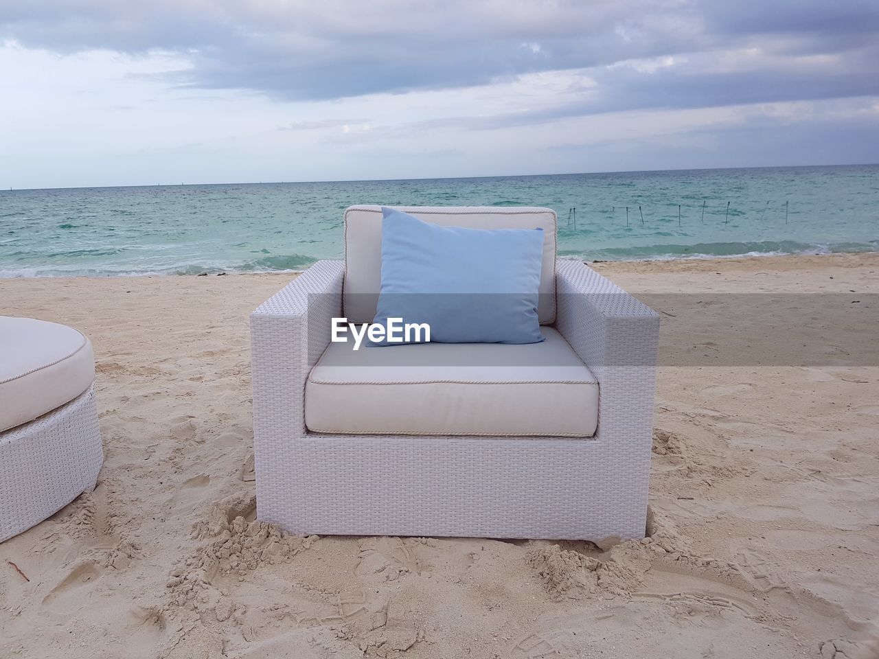 CHAIR ON BEACH AGAINST SEA