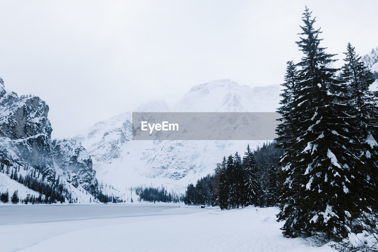 Scenic view of snow covered mountains against sky