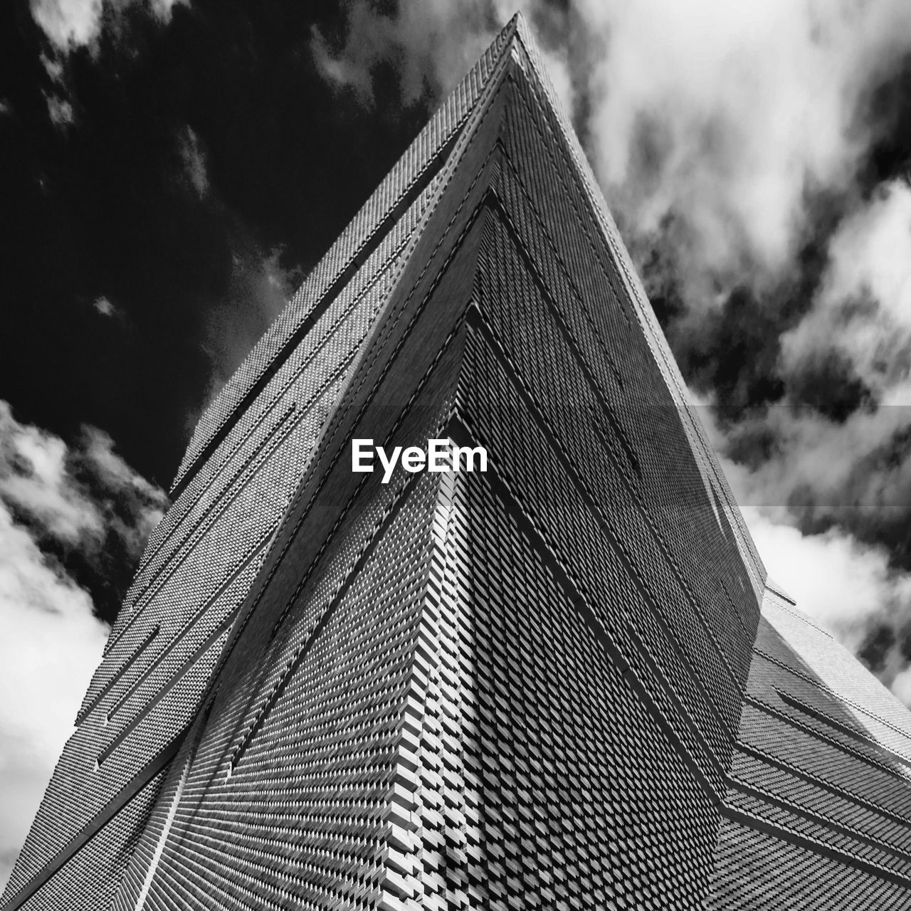 architecture, cloud, built structure, sky, black and white, building exterior, monochrome, monochrome photography, low angle view, building, landmark, skyscraper, triangle shape, nature, white, no people, black, city, tower, outdoors, day, travel destinations, shape