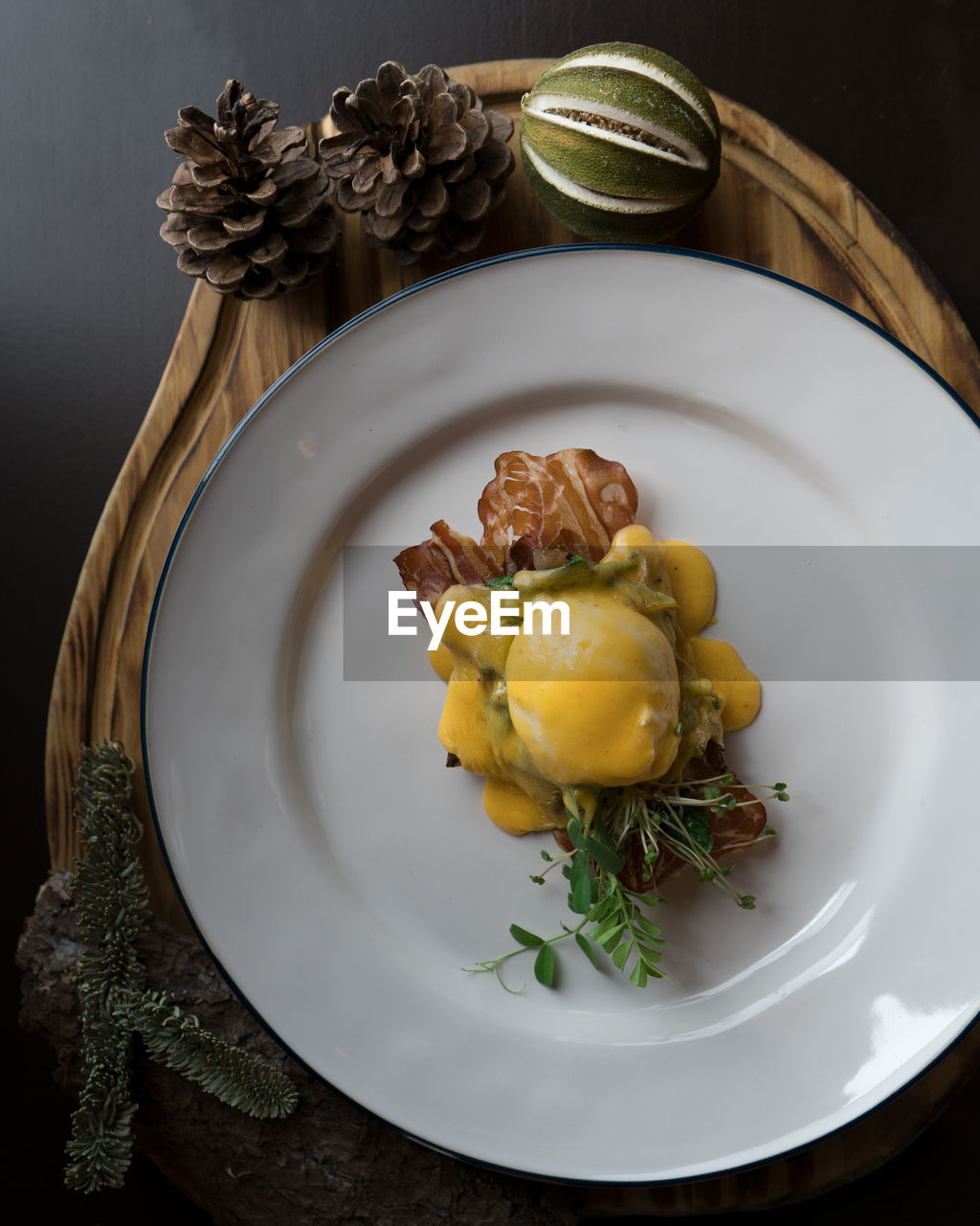 High angle view of eggs benedict in plate on table