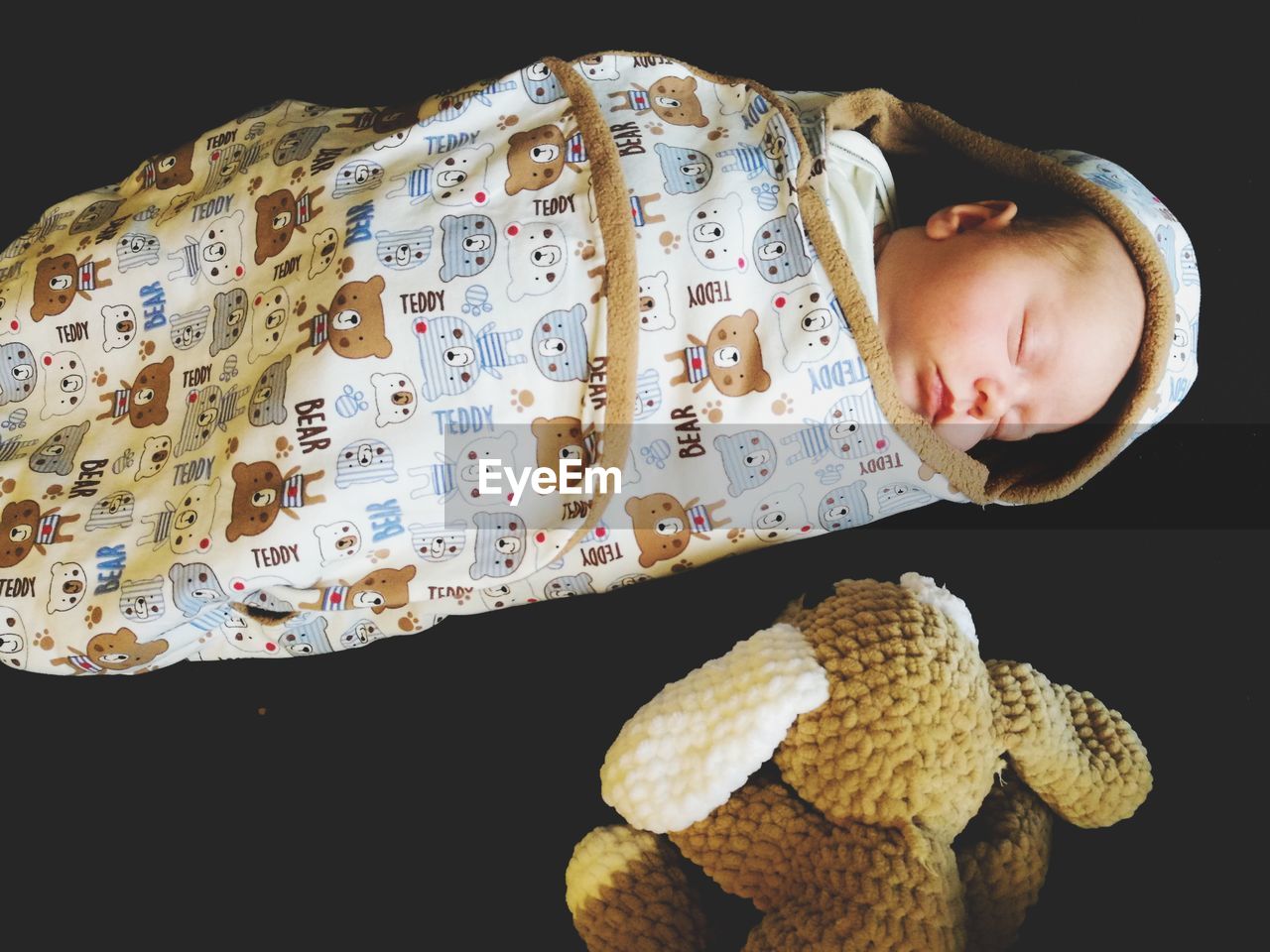 Close-up of cute bay boy sleeping on bed at home