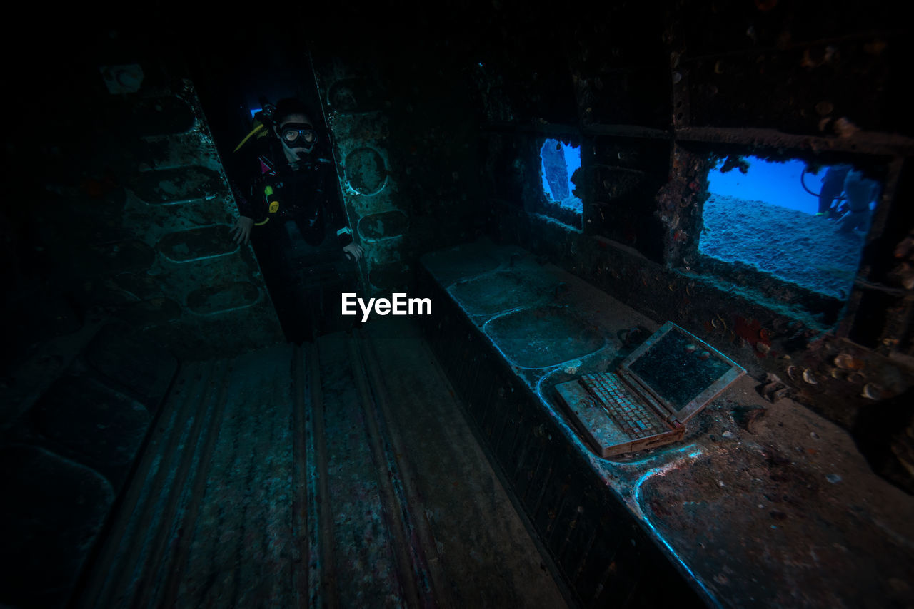 Scuba diver exploring shipwreck