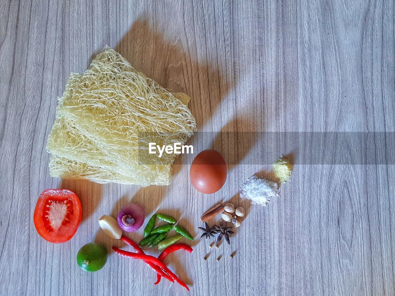 food, food and drink, high angle view, wood, indoors, still life, table, healthy eating, freshness, directly above, no people, vegetable, wellbeing, fruit, flower, ingredient, produce, spice, textile, studio shot, close-up