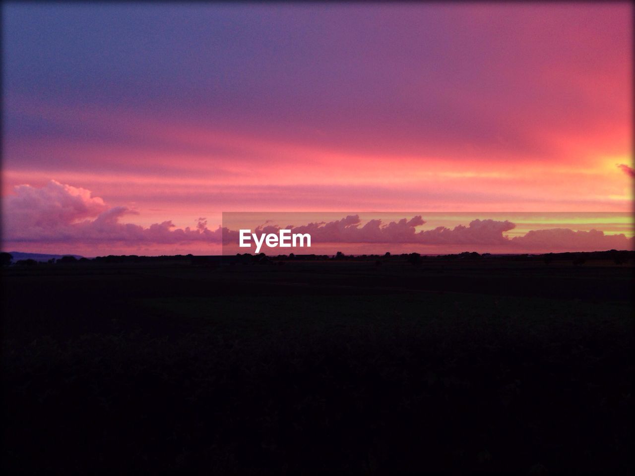 Scenic view of silhouette landscape against sky during sunset