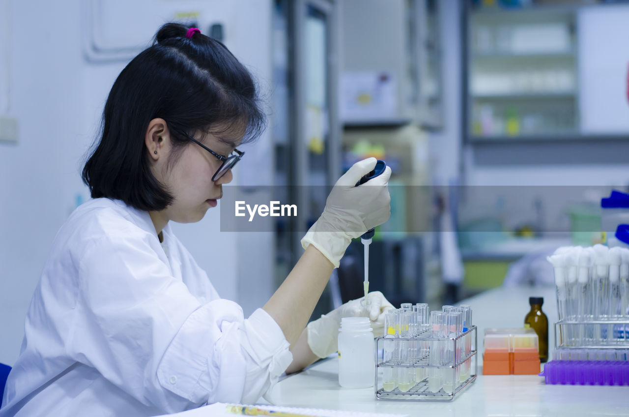 Scientist working at table in laboratory