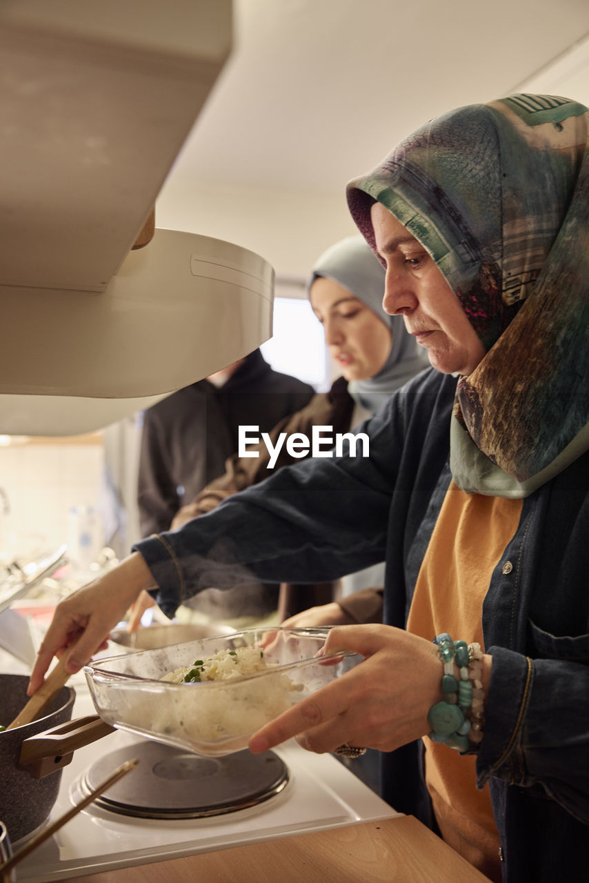 Family preparing dinner together at home