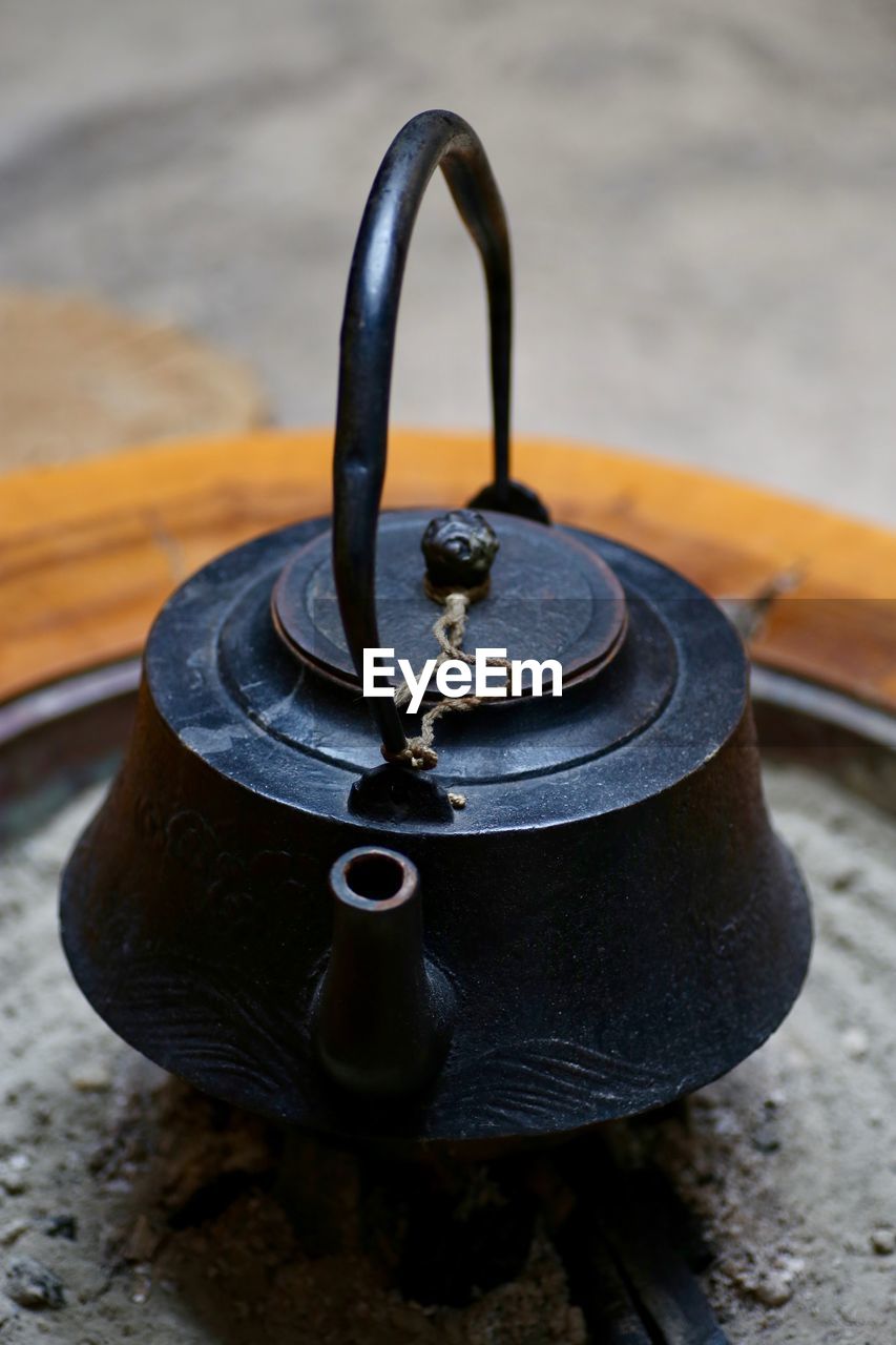 Close-up of old cast iron japanese tea pot