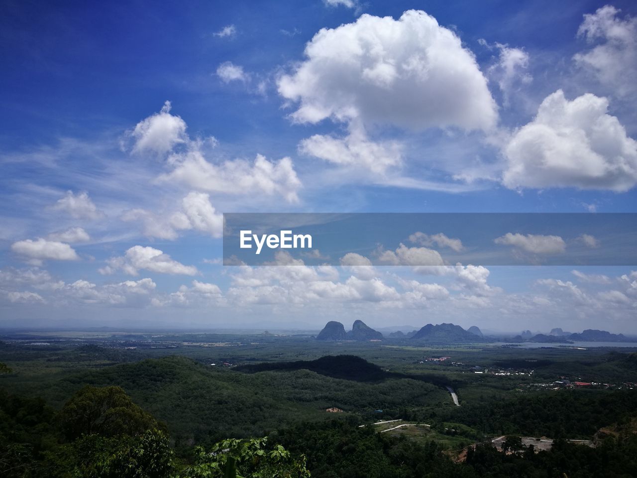 Scenic view of landscape against blue sky