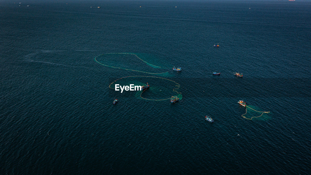 high angle view of sea against sky at night