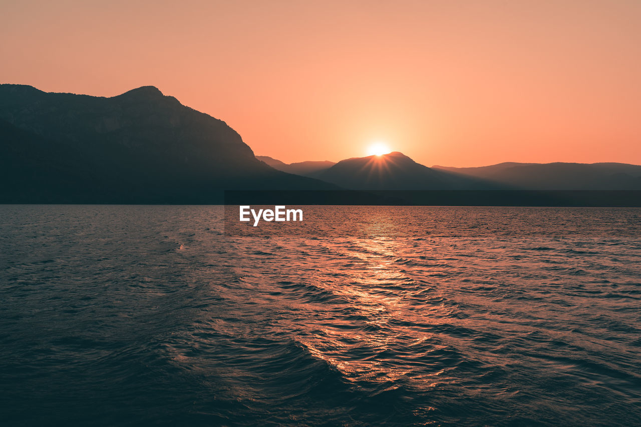 Scenic view of sea against sky during sunset