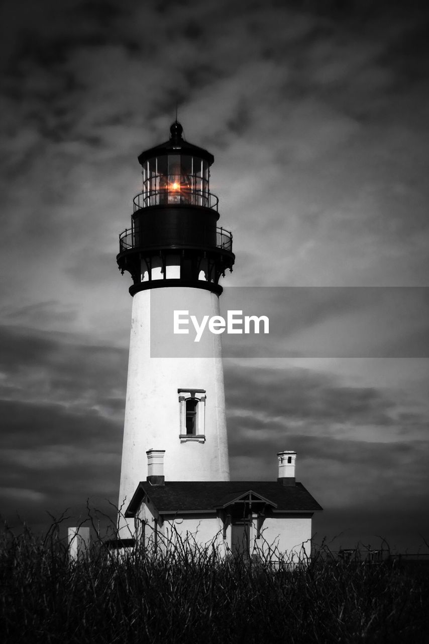 LIGHTHOUSE AGAINST CLOUDY SKY